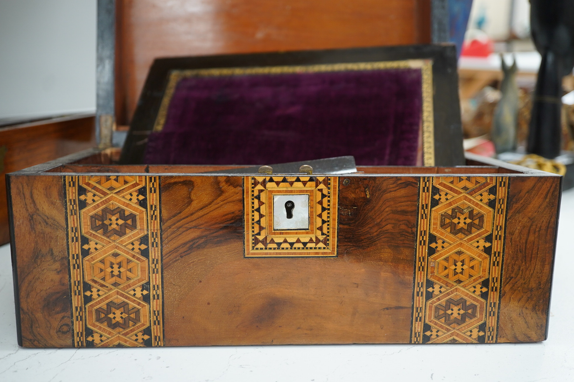 A mahogany brass mounted 19th century writing box and a walnut inlaid and mother of pearl writing box, brass mounted box, 35cm wide. Condition - exterior good, felt on slope torn.